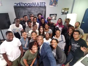 Students gathered during a STEAM-oriented learning experience